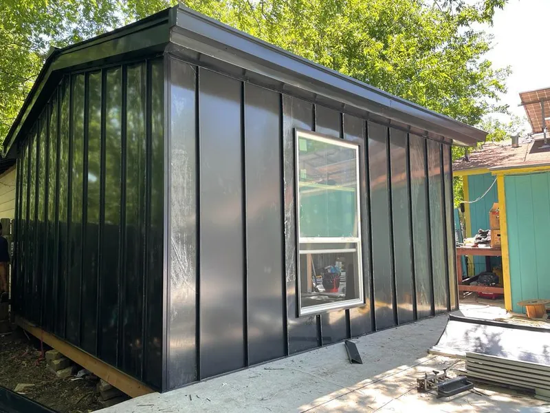 Black standing seam metal wall panels for Roof Inspection in North Hobbs