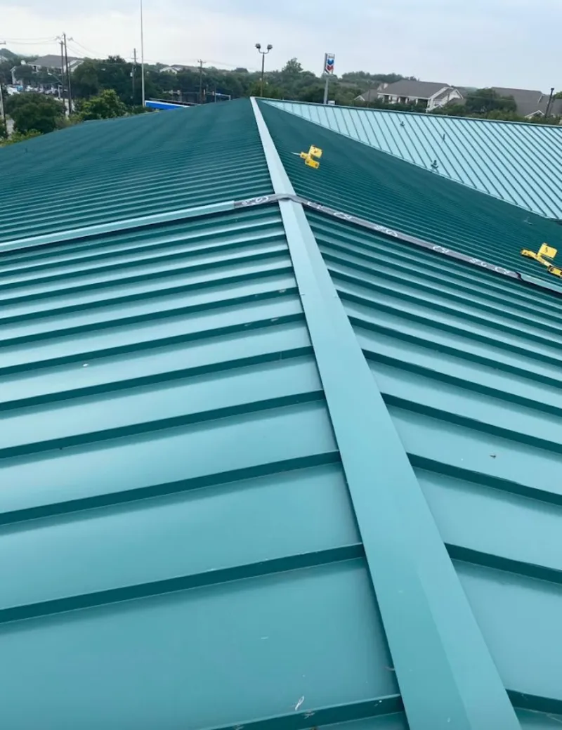 Green commercial metal roof ridge and valley for Metal Roof Repair in North Hobbs
